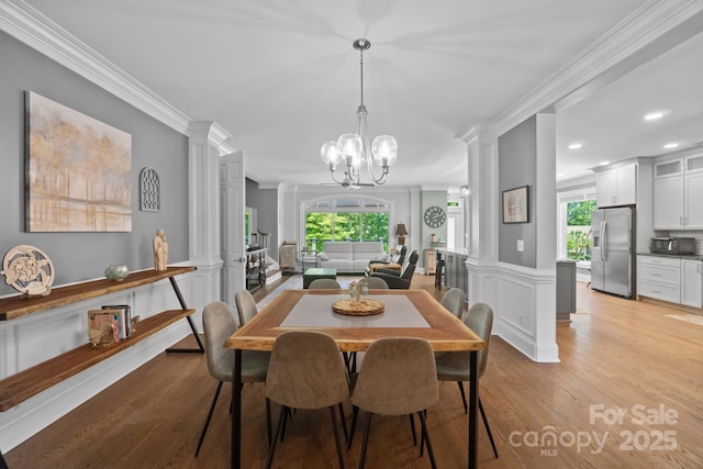 313 Sunset View Ct, York, SC 29745 - dining area featuring decorative columns, light wood finished floors, ornamental molding, a chandelier, and recessed lighting