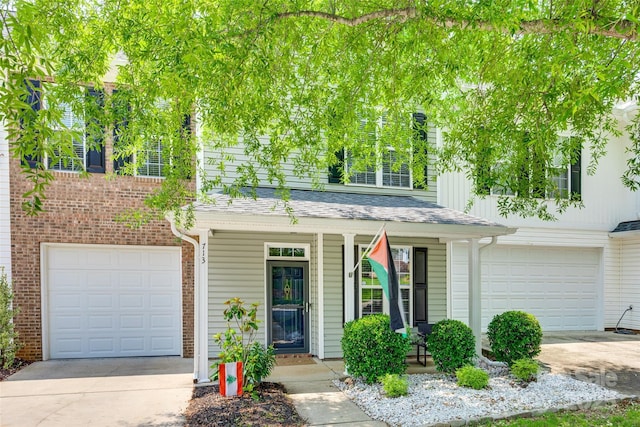 713 Torrey Pines Ln, Fort Mill, SC 29715 - view of front of house featuring driveway, covered porch, and a garage
