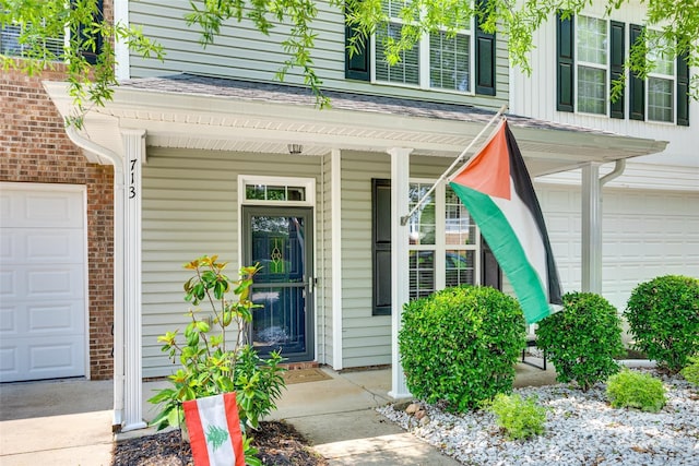 713 Torrey Pines Ln, Fort Mill, SC 29715 - doorway to property featuring a porch and a garage