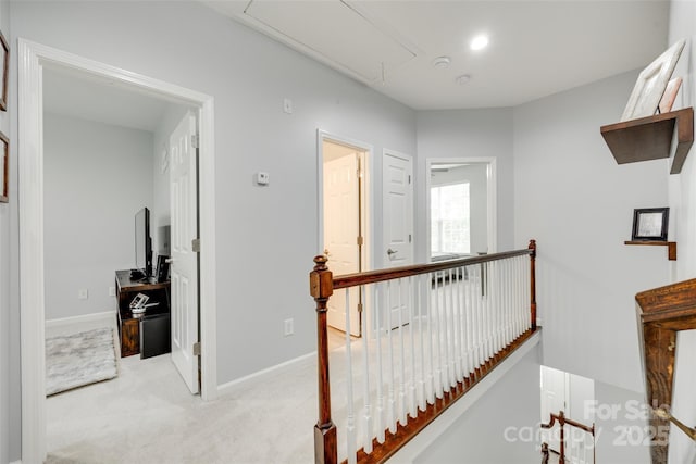 713 Torrey Pines Ln, Fort Mill, SC 29715 - hall featuring attic access, an upstairs landing, and light carpet