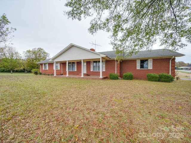 3113 Old Pageland Marshville Rd, Wingate, NC 28174 - ranch-style home featuring a front lawn, a porch, and brick siding
