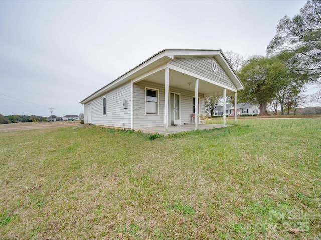 3113 Old Pageland Marshville Rd, Wingate, NC 28174 - view of front of home with a front lawn and a patio