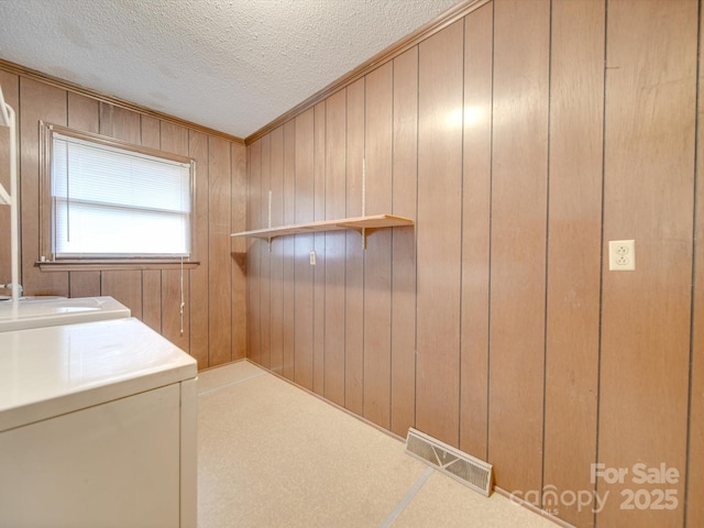 3113 Old Pageland Marshville Rd, Wingate, NC 28174 - laundry room with washer and clothes dryer, a textured ceiling, carpet floors, and wood walls