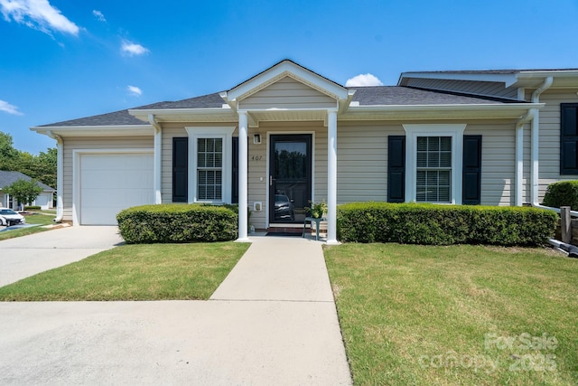 407 Hertling Dr NW, Concord, NC 28027 - view of front of property with a garage, concrete driveway, a front yard, and a shingled roof