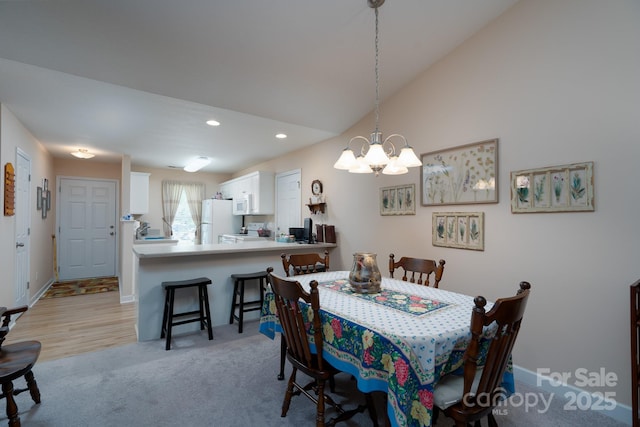 407 Hertling Dr NW, Concord, NC 28027 - dining room with a chandelier, recessed lighting, and light colored carpet
