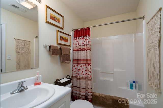407 Hertling Dr NW, Concord, NC 28027 - bathroom featuring vanity and shower / tub combo with curtain