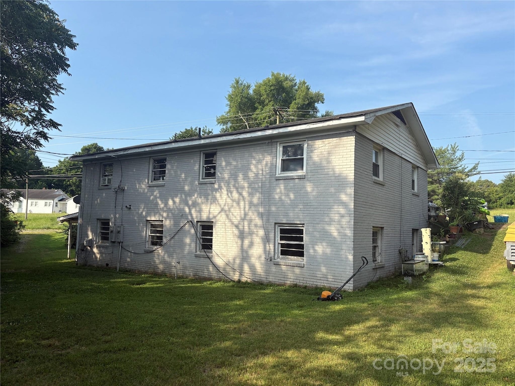 2103 Clawson Ave, Kannapolis, NC 28081 - back of house featuring a lawn