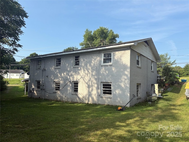 2103 Clawson Ave, Kannapolis, NC 28081 - back of house featuring a lawn