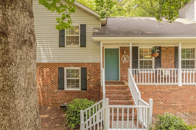 6418 Tivoli Ct, Charlotte, NC 28211 - entrance to property with brick siding, a porch, and roof with shingles
