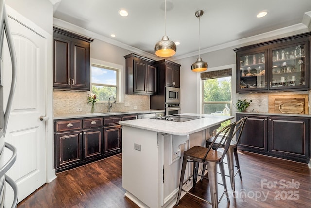 7805 Crooked Creek Church Rd, Monroe, NC 28110 - kitchen featuring a kitchen breakfast bar, healthy amount of natural light, stainless steel appliances, crown molding, and decorative backsplash