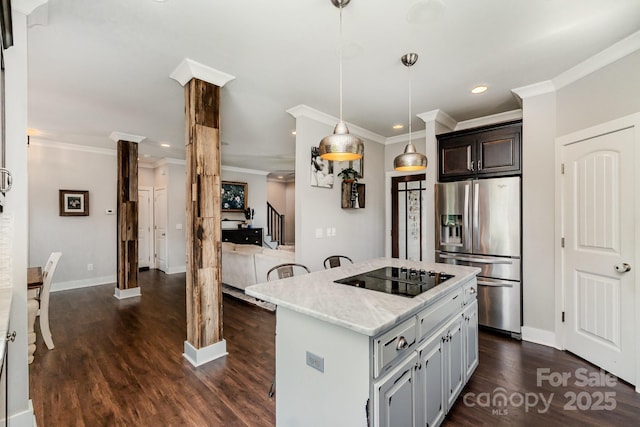 7805 Crooked Creek Church Rd, Monroe, NC 28110 - kitchen featuring stainless steel fridge, black electric cooktop, ornate columns, dark wood-style floors, and recessed lighting