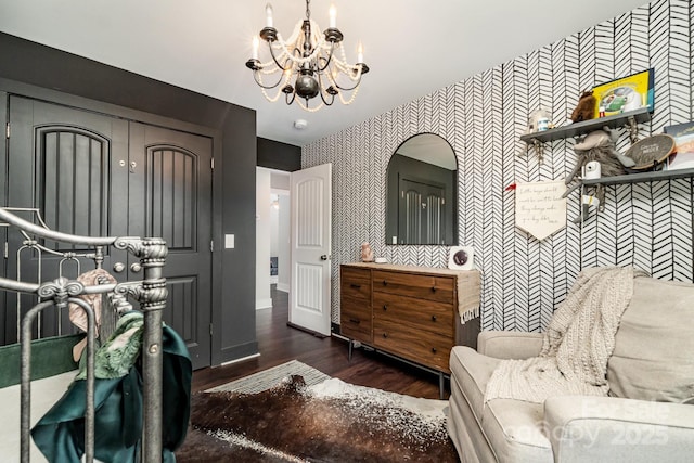 7805 Crooked Creek Church Rd, Monroe, NC 28110 - bathroom featuring wallpapered walls, a chandelier, an accent wall, vanity, and wood finished floors