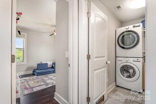 7805 Crooked Creek Church Rd, Monroe, NC 28110 - laundry area featuring stacked washing machine and dryer, ceiling fan, and wood finished floors