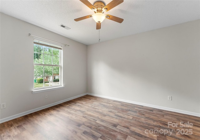 1326 Anthem Ct, Charlotte, NC 28205 - spare room featuring wood finished floors, a ceiling fan, and a textured ceiling