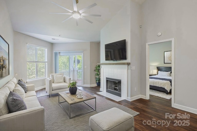 795 Peninsula Dr, Davidson, NC 28036 - living room with wood finished floors, ceiling fan, high vaulted ceiling, and a fireplace