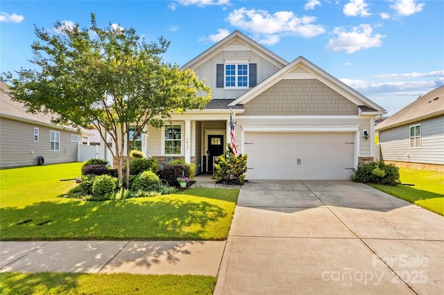 3835 Norman View Dr, Sherrills Ford, NC 28673 - view of front of property featuring driveway, a front lawn, board and batten siding, an attached garage, and stone siding