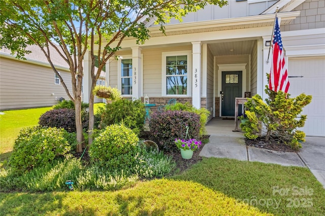 3835 Norman View Dr, Sherrills Ford, NC 28673 - property entrance with board and batten siding, a porch, an attached garage, stone siding, and a lawn