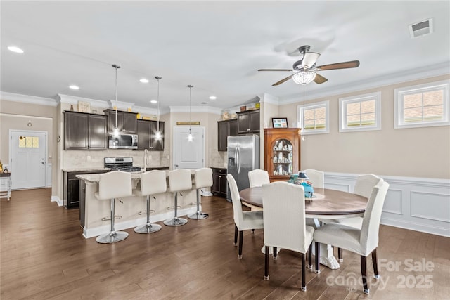 3835 Norman View Dr, Sherrills Ford, NC 28673 - dining room featuring a ceiling fan, crown molding, dark wood finished floors, recessed lighting, and a wainscoted wall