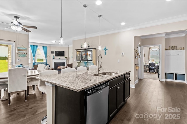 3835 Norman View Dr, Sherrills Ford, NC 28673 - kitchen featuring stainless steel dishwasher, a warm lit fireplace, a ceiling fan, ornamental molding, and dark wood finished floors