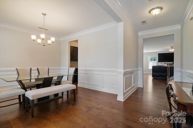 12704 Franklin Square Rd, Charlotte, NC 28213 - dining area with ornamental molding, a chandelier, dark wood-style floors, and wainscoting