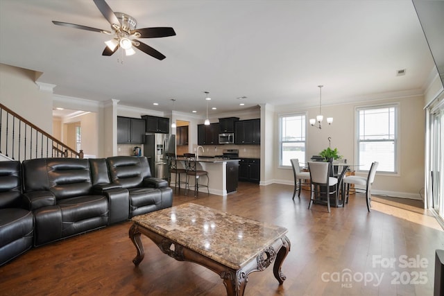 12704 Franklin Square Rd, Charlotte, NC 28213 - living room with ornamental molding, ceiling fan, a chandelier, dark wood-style flooring, and recessed lighting