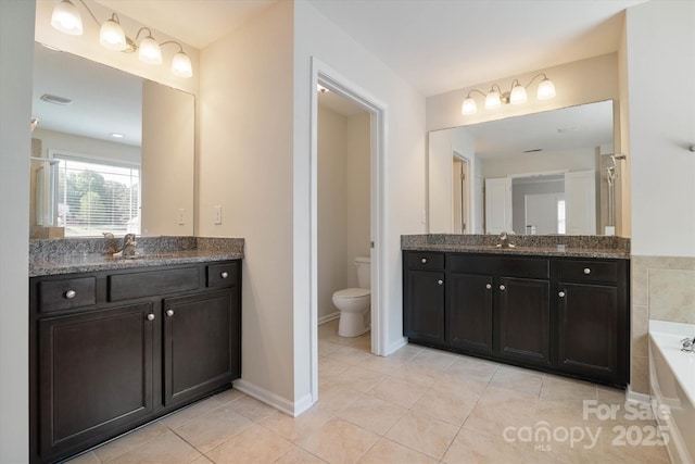 12704 Franklin Square Rd, Charlotte, NC 28213 - bathroom featuring vanity, a garden tub, and tile patterned flooring