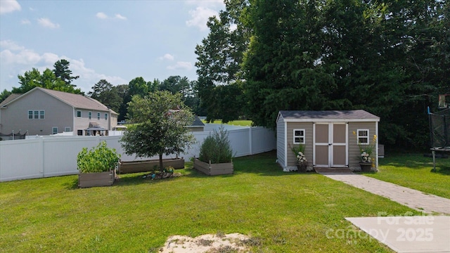 12704 Franklin Square Rd, Charlotte, NC 28213 - view of yard featuring a vegetable garden and a storage unit