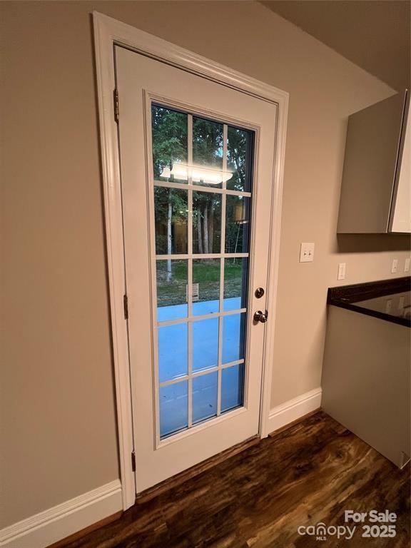 507 Putter Pl, Chester, SC 29706 - doorway with baseboards and dark wood-style floors