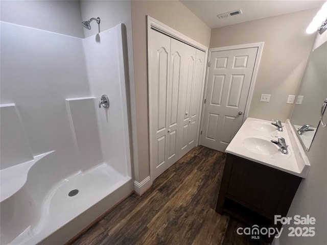 507 Putter Pl, Chester, SC 29706 - full bathroom featuring double vanity, wood finished floors, and a shower
