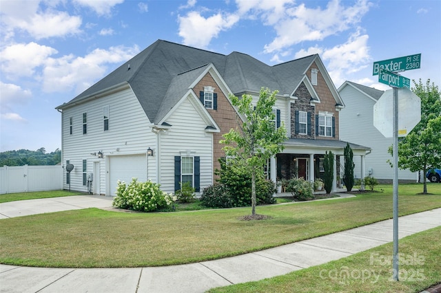 2380 Fairport Dr SE, Concord, NC 28025 - view of front facade with an attached garage, concrete driveway, covered porch, and roof with shingles