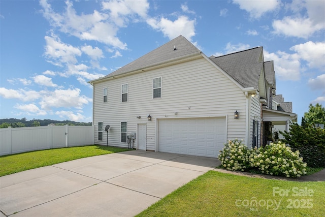 2380 Fairport Dr SE, Concord, NC 28025 - view of home's exterior featuring driveway, a shingled roof, and an attached garage