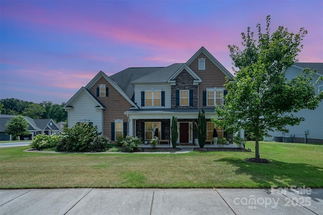2380 Fairport Dr SE, Concord, NC 28025 - craftsman-style house featuring a porch, stone siding, and a front yard