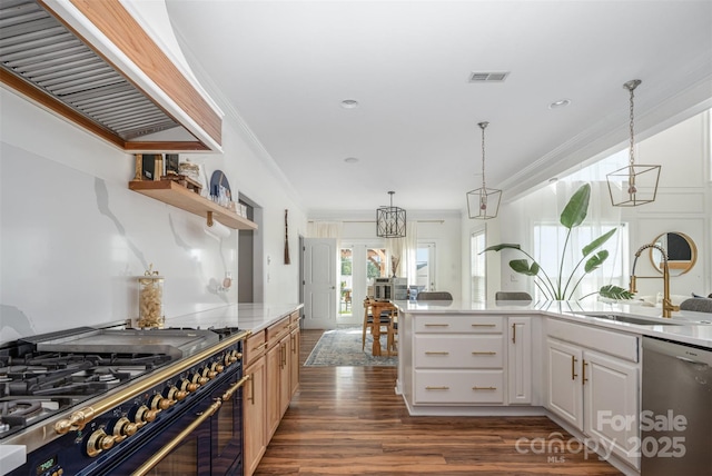 2380 Fairport Dr SE, Concord, NC 28025 - kitchen featuring range with gas stovetop, dishwasher, crown molding, dark wood-style flooring, and wall chimney exhaust hood