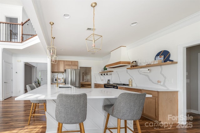 2380 Fairport Dr SE, Concord, NC 28025 - kitchen featuring custom range hood, freestanding refrigerator, open shelves, crown molding, and a kitchen bar