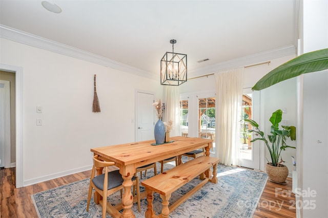 2380 Fairport Dr SE, Concord, NC 28025 - dining area featuring ornamental molding, a chandelier, light wood-type flooring, and french doors