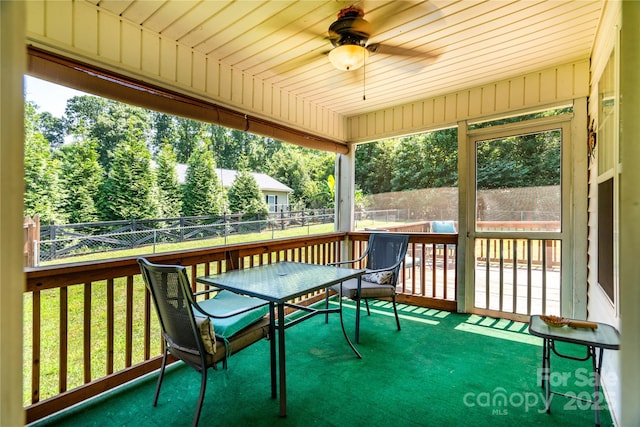 958 Hillard Ln, Lincolnton, NC 28092 - sunroom / solarium featuring a ceiling fan, outdoor dining space, and view of wooded area