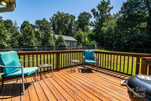 958 Hillard Ln, Lincolnton, NC 28092 - deck featuring a fenced backyard, grilling area, and view of wooded area