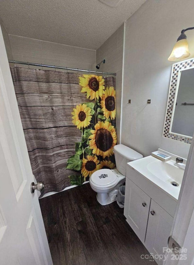 11 Long Glen Ct Unit 113, Columbia, SC 29229 - full bathroom featuring vanity, a textured ceiling, wood finished floors, and curtained shower