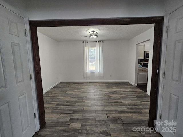 11 Long Glen Ct Unit 113, Columbia, SC 29229 - unfurnished dining area featuring dark wood finished floors and a textured ceiling