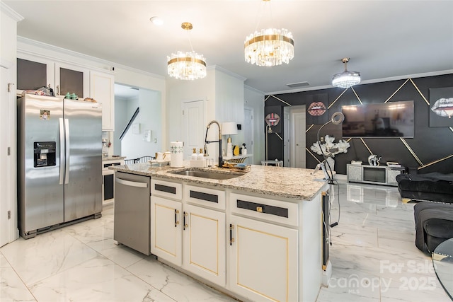 154 Tanner Loop, Troutman, NC 28166 - kitchen with stainless steel appliances, a chandelier, ornamental molding, light stone counters, and light marble finish floors