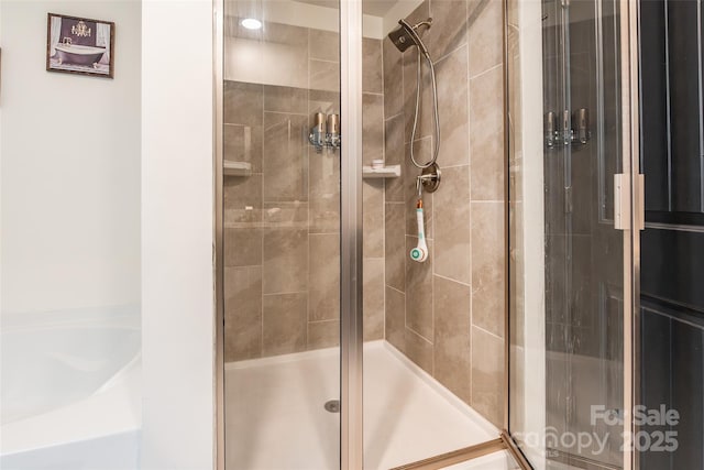 154 Tanner Loop, Troutman, NC 28166 - bathroom with a shower stall and a bath