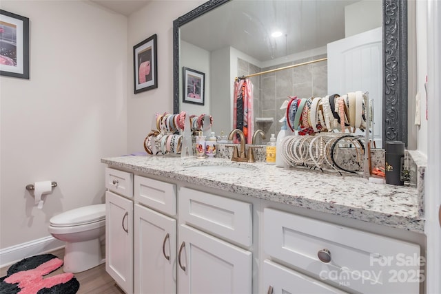 154 Tanner Loop, Troutman, NC 28166 - bathroom with vanity, tiled shower, and wood finished floors