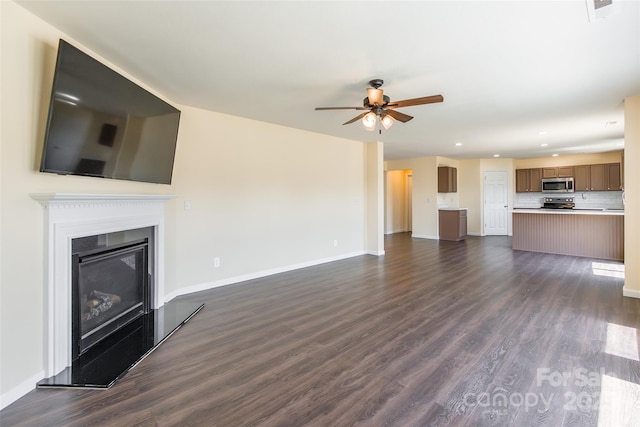 2357 Riding Trail Rd, Gastonia, NC 28054 - unfurnished living room featuring ceiling fan, recessed lighting, dark wood-style floors, and a glass covered fireplace