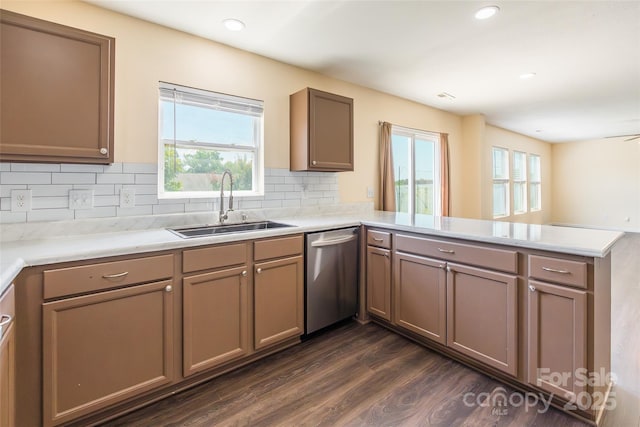 2357 Riding Trail Rd, Gastonia, NC 28054 - kitchen with dishwasher, a peninsula, dark wood-type flooring, backsplash, and light countertops
