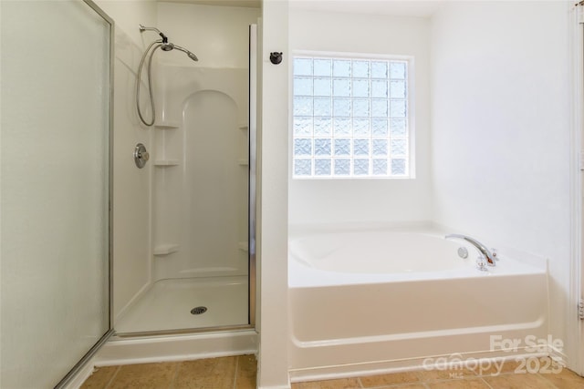 2357 Riding Trail Rd, Gastonia, NC 28054 - full bathroom with a shower stall, a bath, and tile patterned flooring