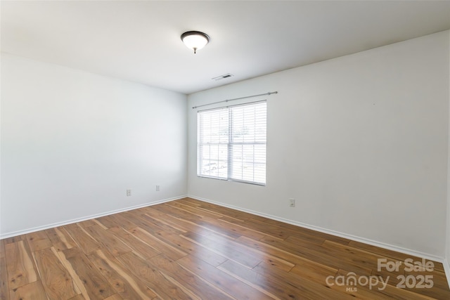 2357 Riding Trail Rd, Gastonia, NC 28054 - spare room with wood-type flooring and baseboards