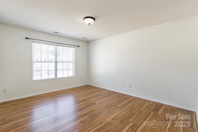 2357 Riding Trail Rd, Gastonia, NC 28054 - spare room with wood finished floors and ornamental molding