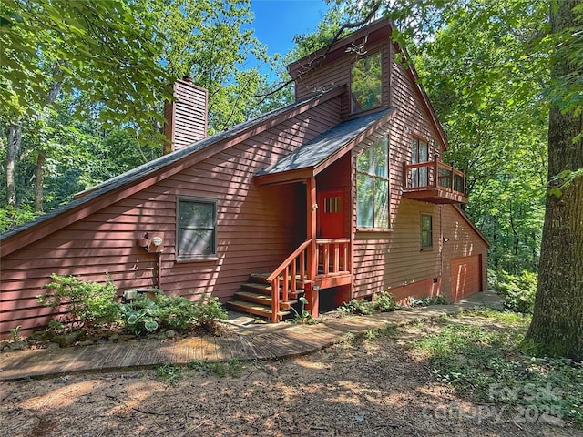 5685 Pine Ridge Dr, Connelly Springs, NC 28612 - rear view of property with a chimney, a garage, and a balcony