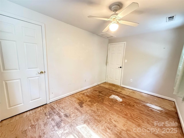 5685 Pine Ridge Dr, Connelly Springs, NC 28612 - spare room with a ceiling fan, attic access, and wood finished floors