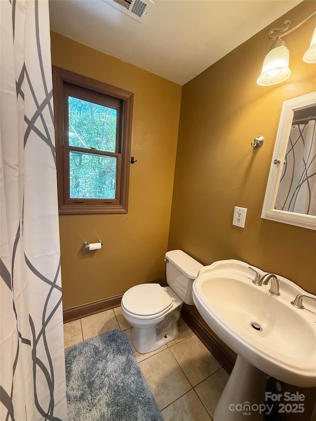 5685 Pine Ridge Dr, Connelly Springs, NC 28612 - full bath featuring tile patterned flooring and curtained shower